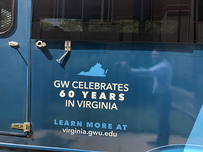 Painted bus says "GW Celebrates 60 Years in Virginia, Learn more at virginia.gwu.edu"