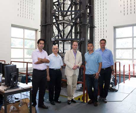 GW research team pictured in front of the model on the shake table
